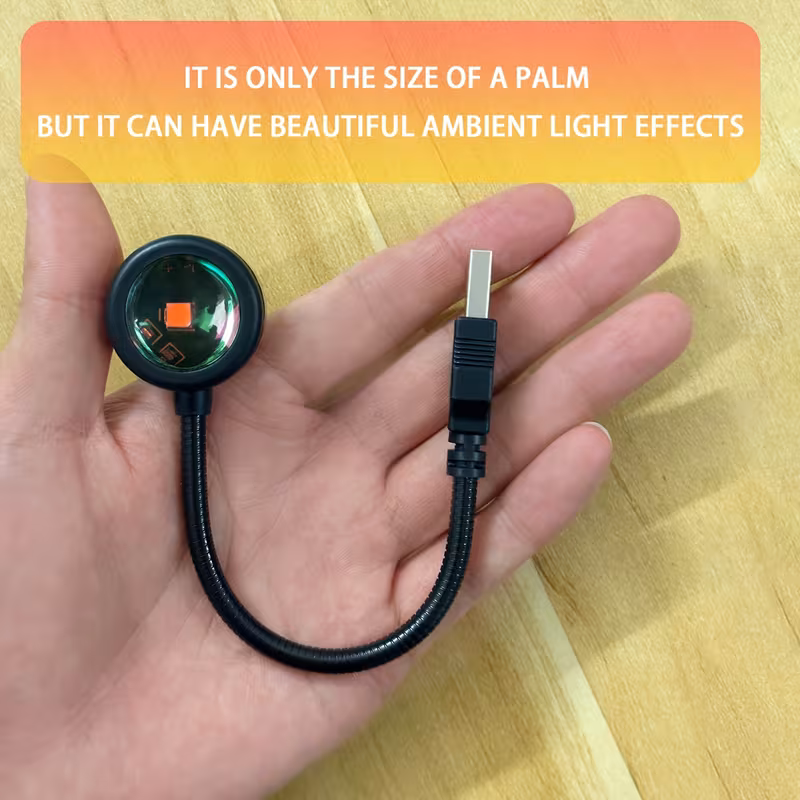 The compact sunset lamp resting in the palm of a hand